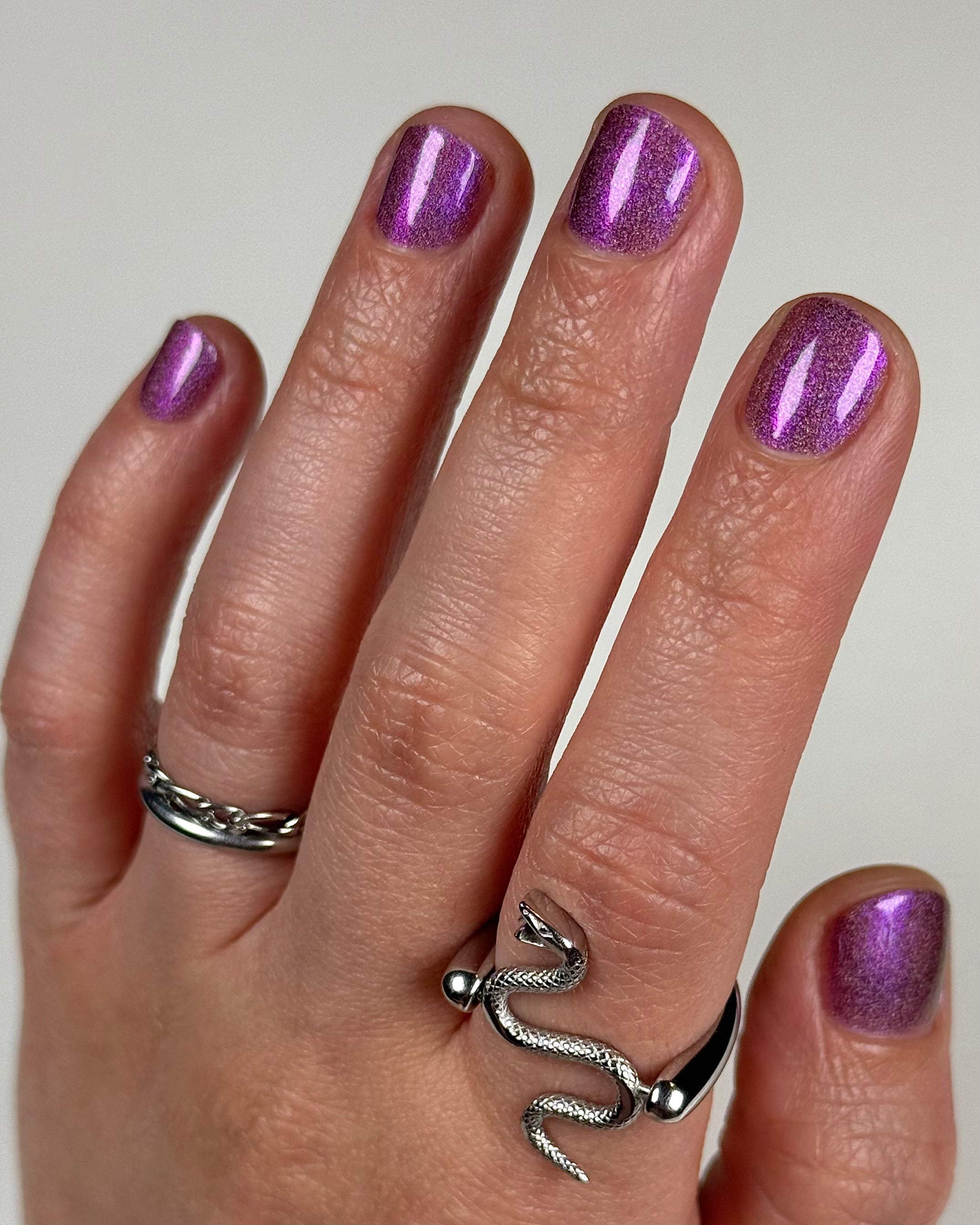Keys to the Kingdom by Glitch Lacquer, berry multichrome holo swatch, light-medium skin tone