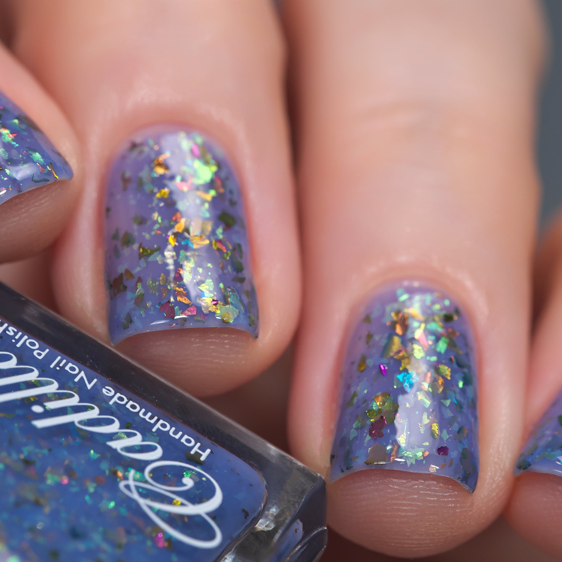 Cadillacquer Don't Worry purple pink chameleon iridescent crelly nail polish, swatched on four nails, light skin, studio lighting