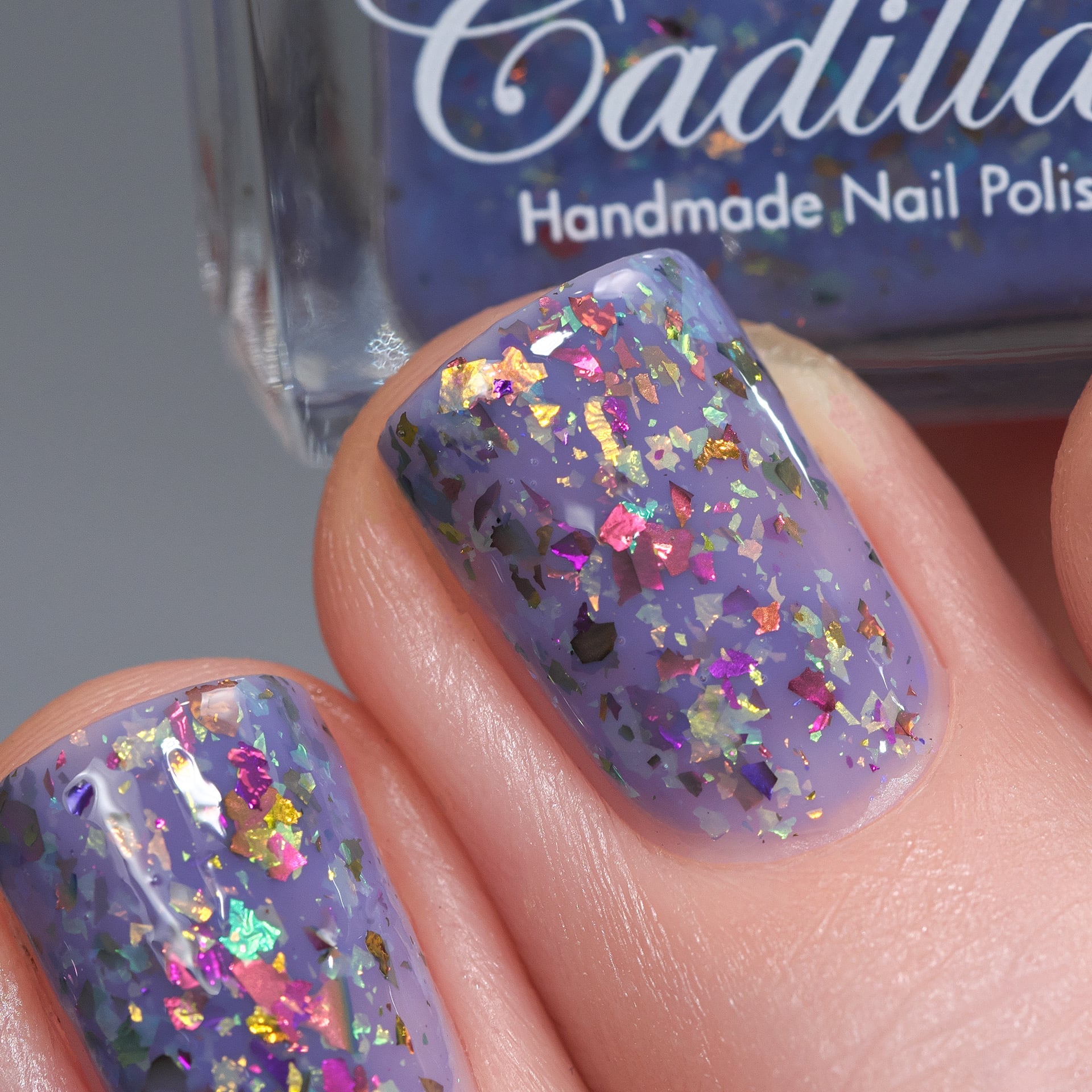 Cadillacquer Don't Worry purple pink chameleon iridescent crelly nail polish, swatched on two nails, light skin, bright daylight lighting