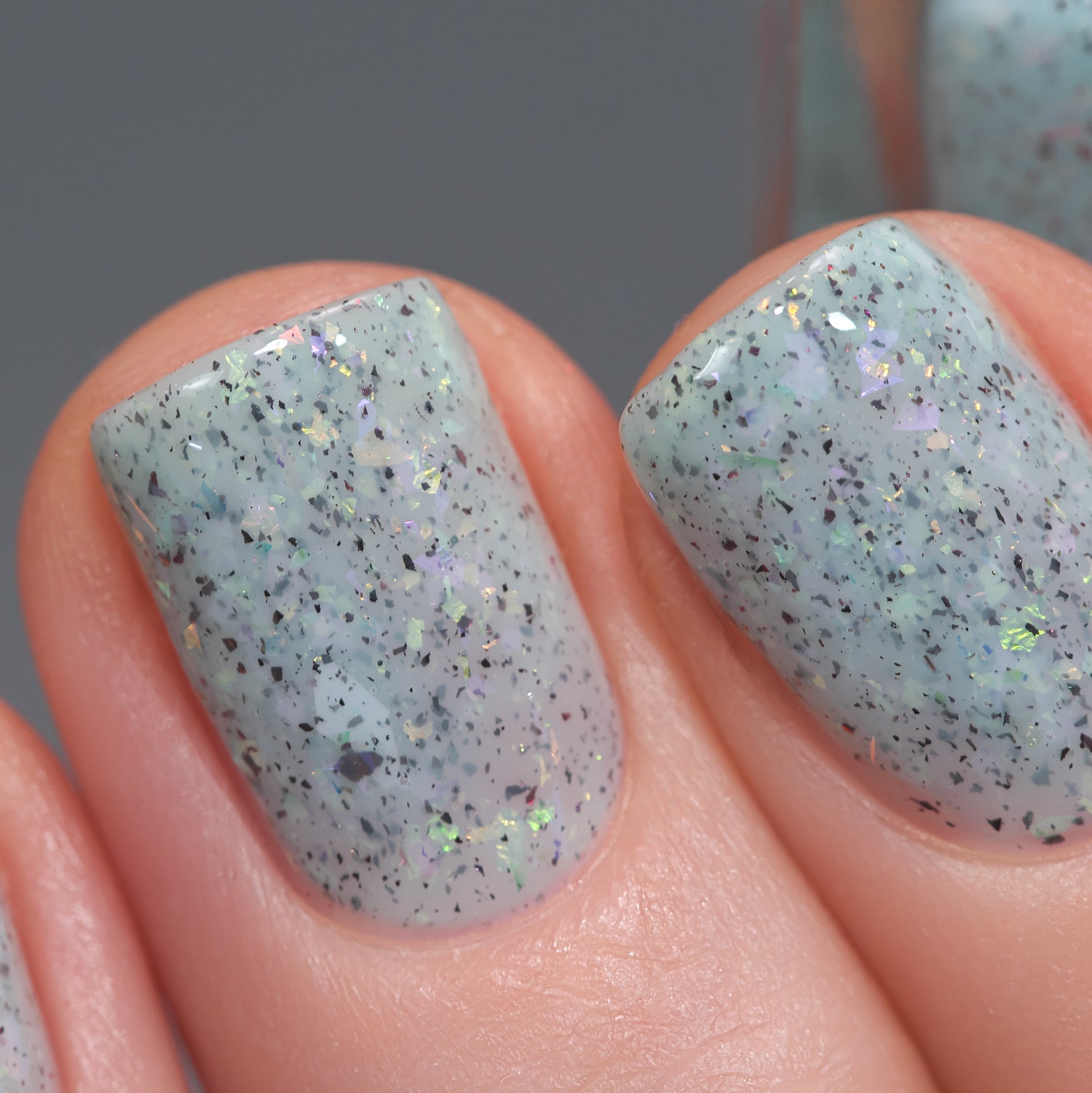 Cadillacquer Fresh Sheets pastel mint iridescent crelly nail polish, swatched on four nails, light skin, studio lighting, by @Lakodzen