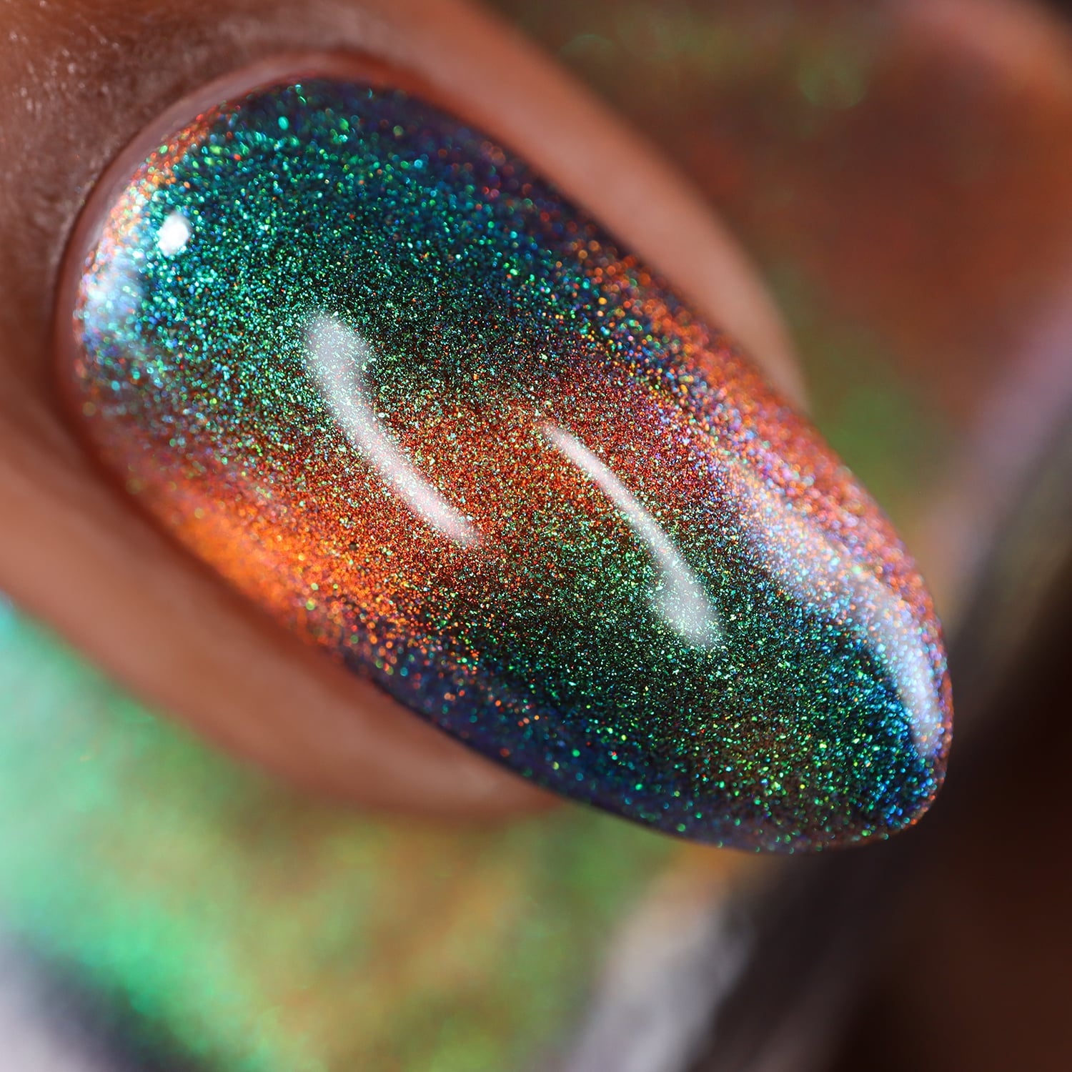 Magnetic holographic multichrome Cadillacquer nail polish in Once You See It, extreme macro closeup of a single oval nail showing a deep teal-green field with a vivid burnt orange diagonal magnetic band and intense green-to-blue holographic shimmer scatter, medium-deep skin tone, studio lighting, swatched by @doseoflolade