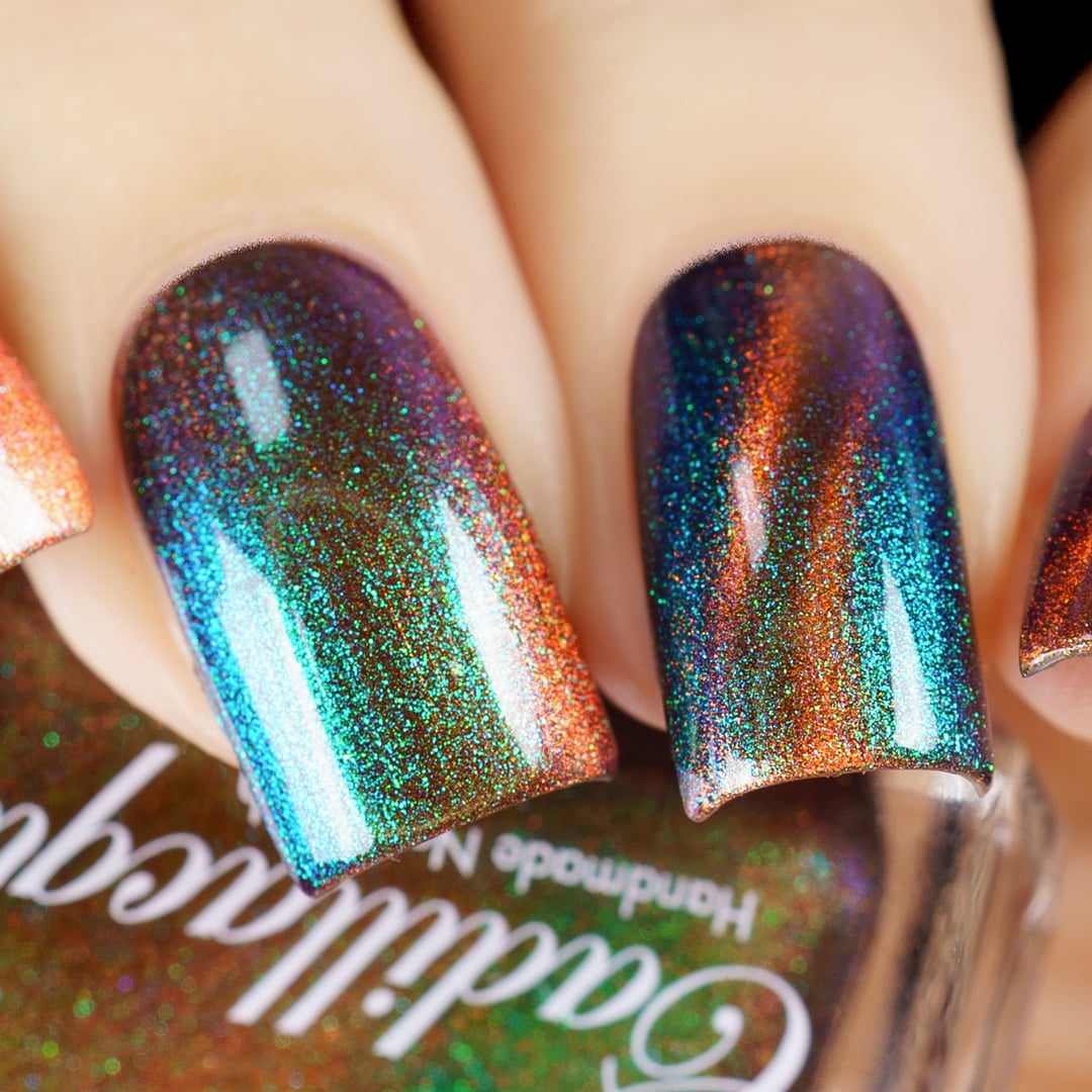 Magnetic multichrome holographic Cadillacquer nail polish in Once You See It, swatched on four square nails showing a diagonal burnt copper-orange magnetic band over a deep violet-purple field with vivid teal, green, and blue aurora shimmer shifting across the surface, light skin tone, studio lighting, swatched by @yyulia_m