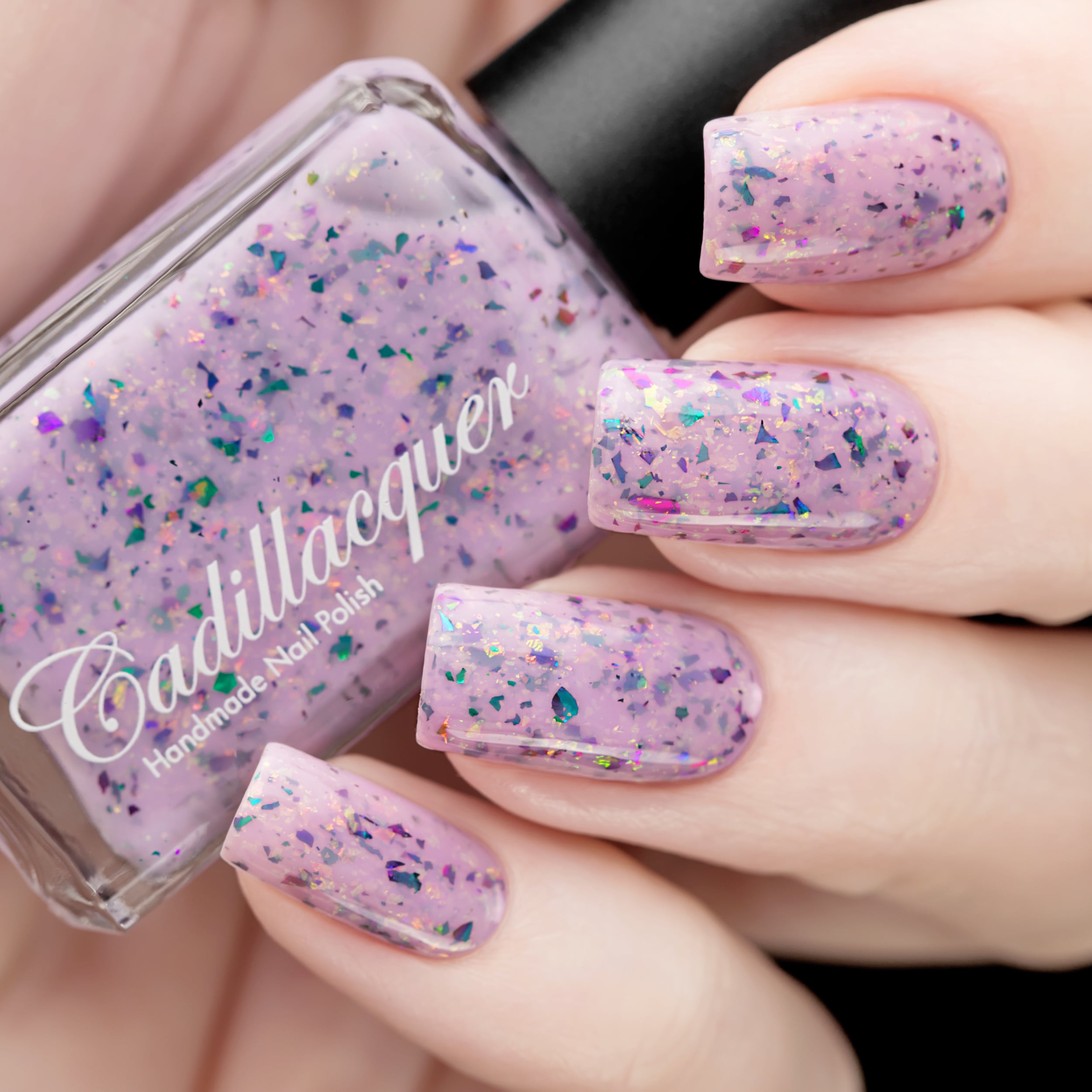 Cadillacquer Sweet Nothing pink teal chameleon iridescent crelly nail polish, swatched on four nails, light skin, studio lighting