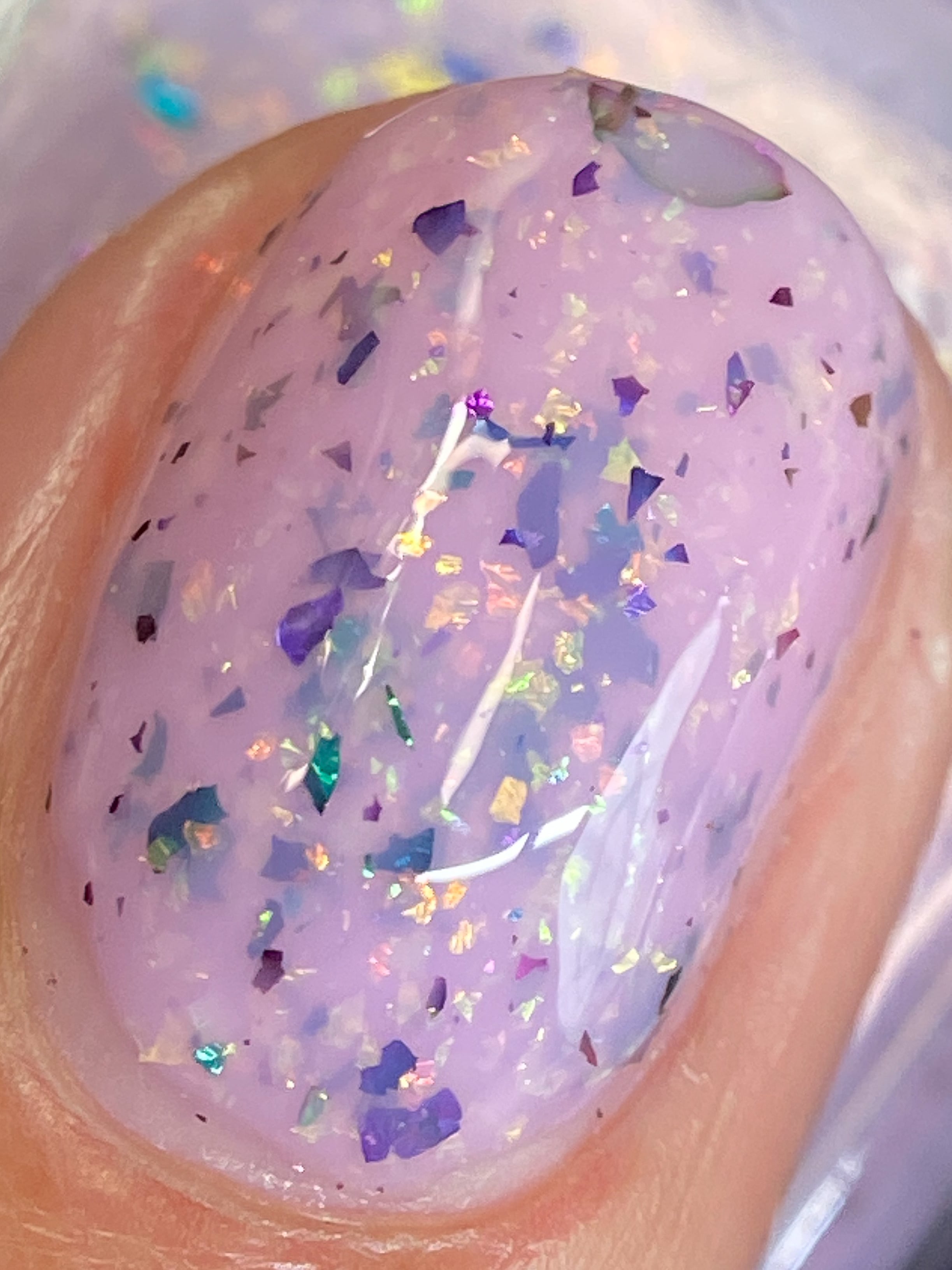 Cadillacquer Sweet Nothing pink teal chameleon iridescent crelly nail polish, macro single-nail swatch, light-medium skin, bright daylight lighting