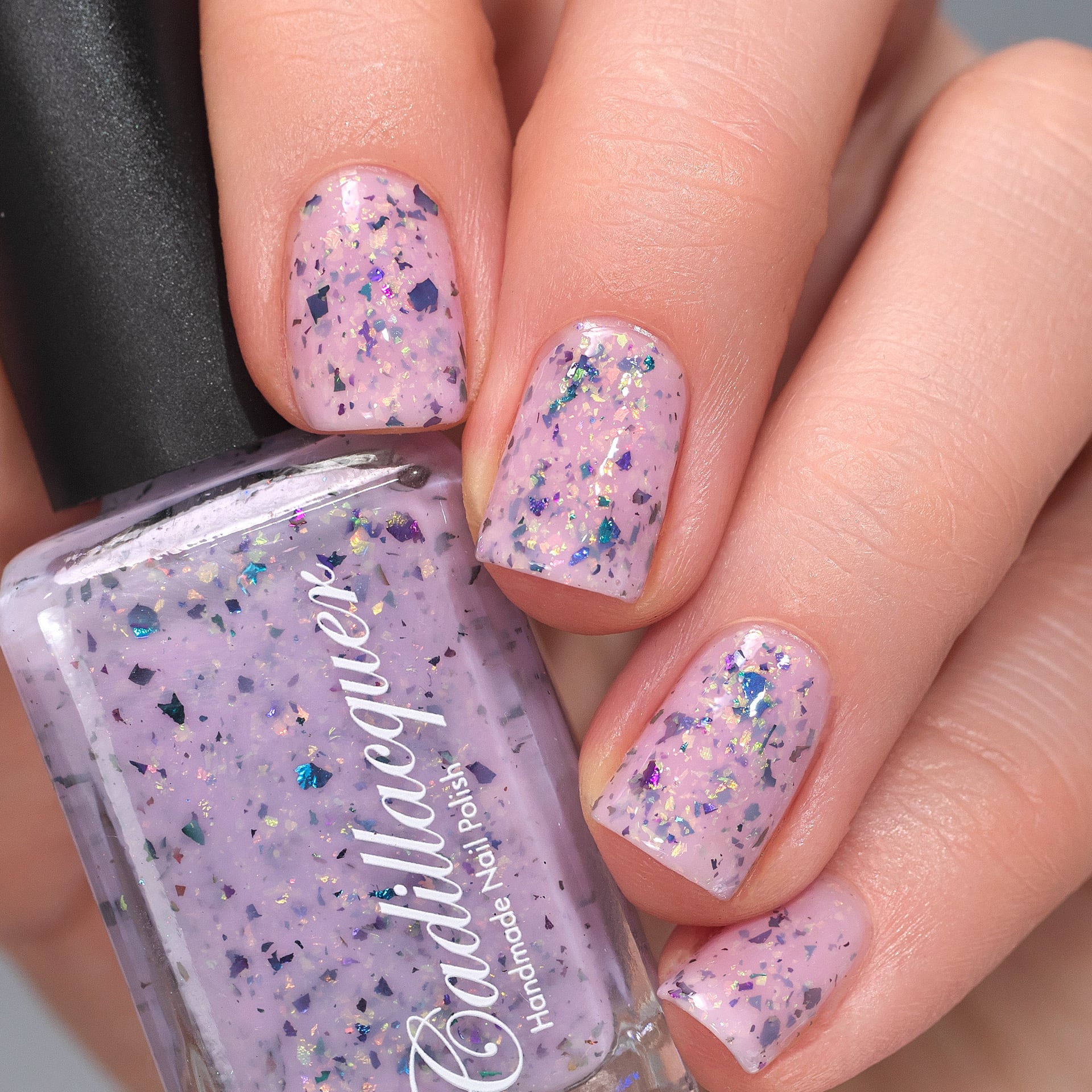 Cadillacquer Sweet Nothing pink teal chameleon iridescent crelly nail polish, swatched on four nails, light skin, studio lighting