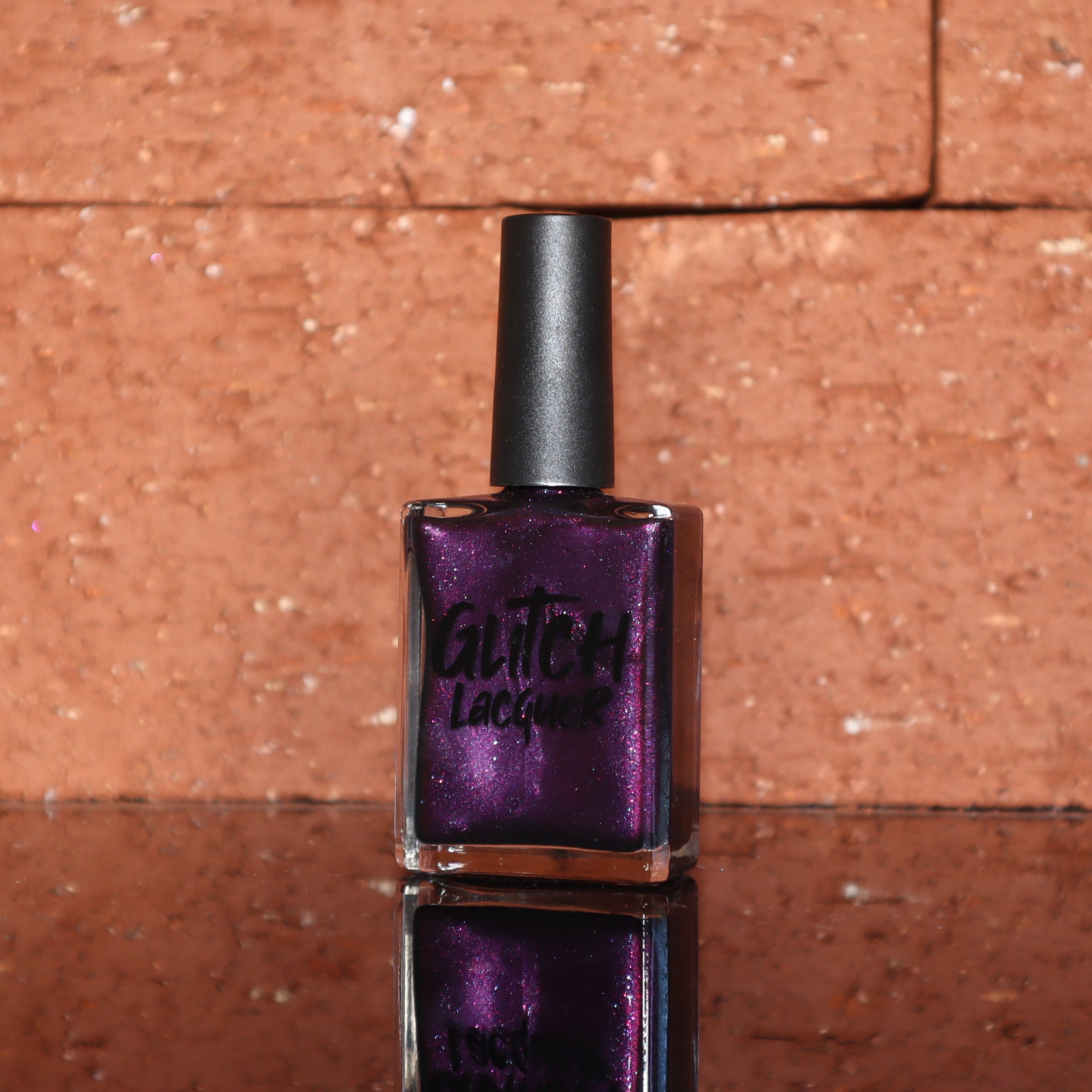 Sister Outsider by Glitch Lacquer, blackened purple jelly with magenta-purple sparkle