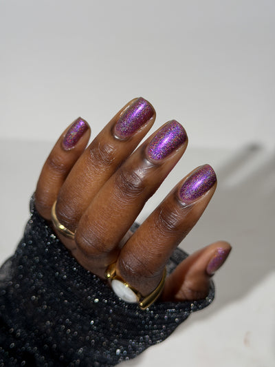 Keys to the Kingdom by Glitch Lacquer, berry multichrome holo swatch on deep skin tone, oval nails