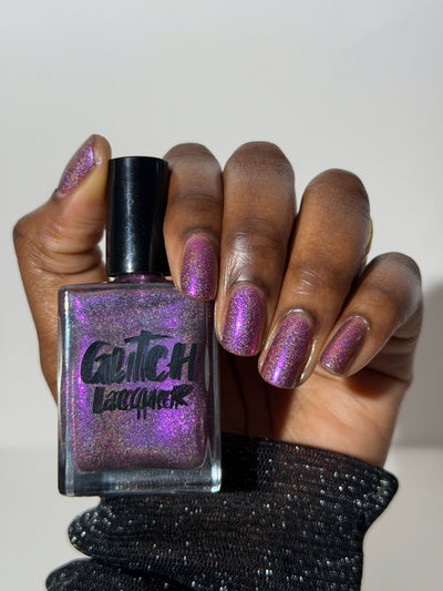 Keys to the Kingdom by Glitch Lacquer, berry multichrome holo on a deep skin tone hand