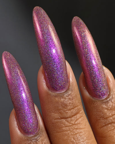 Keys to the Kingdom by Glitch Lacquer, berry multichrome holo swatch on rich skin tone, almond nails