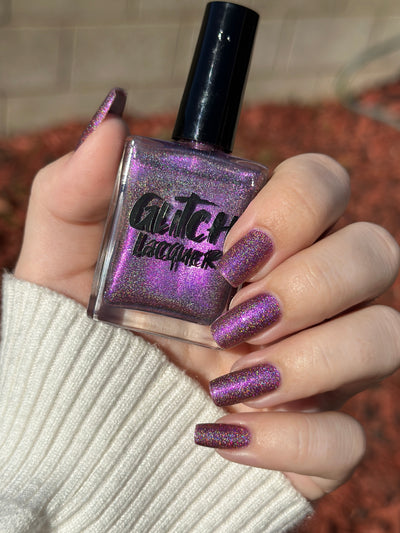 Keys to the Kingdom by Glitch Lacquer, berry multichrome holo bottle and swatch, light skin tone