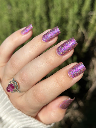 Keys to the Kingdom by Glitch Lacquer, berry multichrome holo swatch on light skin, square nails