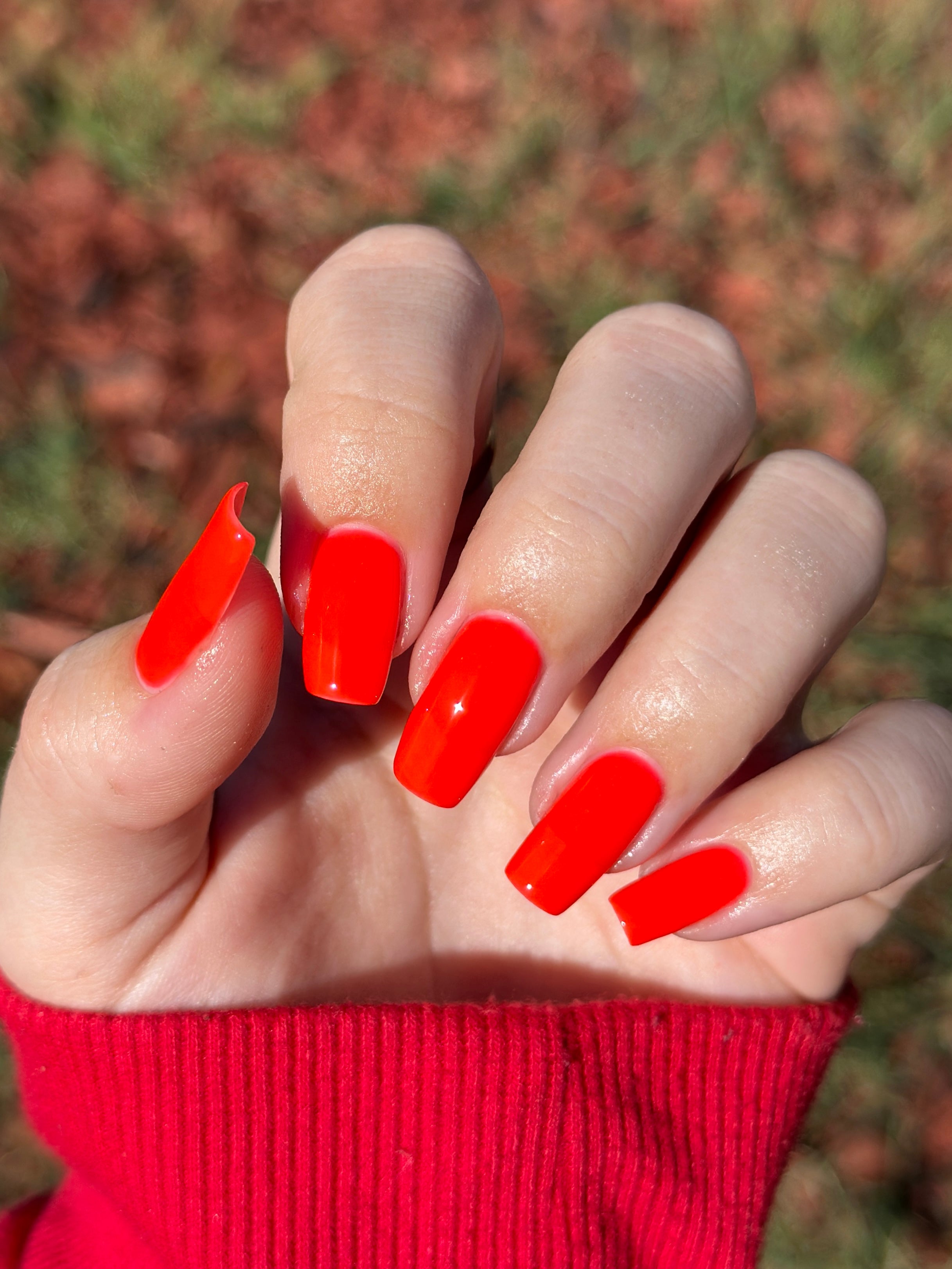 Palestinian Poppy by Glitch Lacquer, warm red crelly swatch on light skin tone, coffin nails