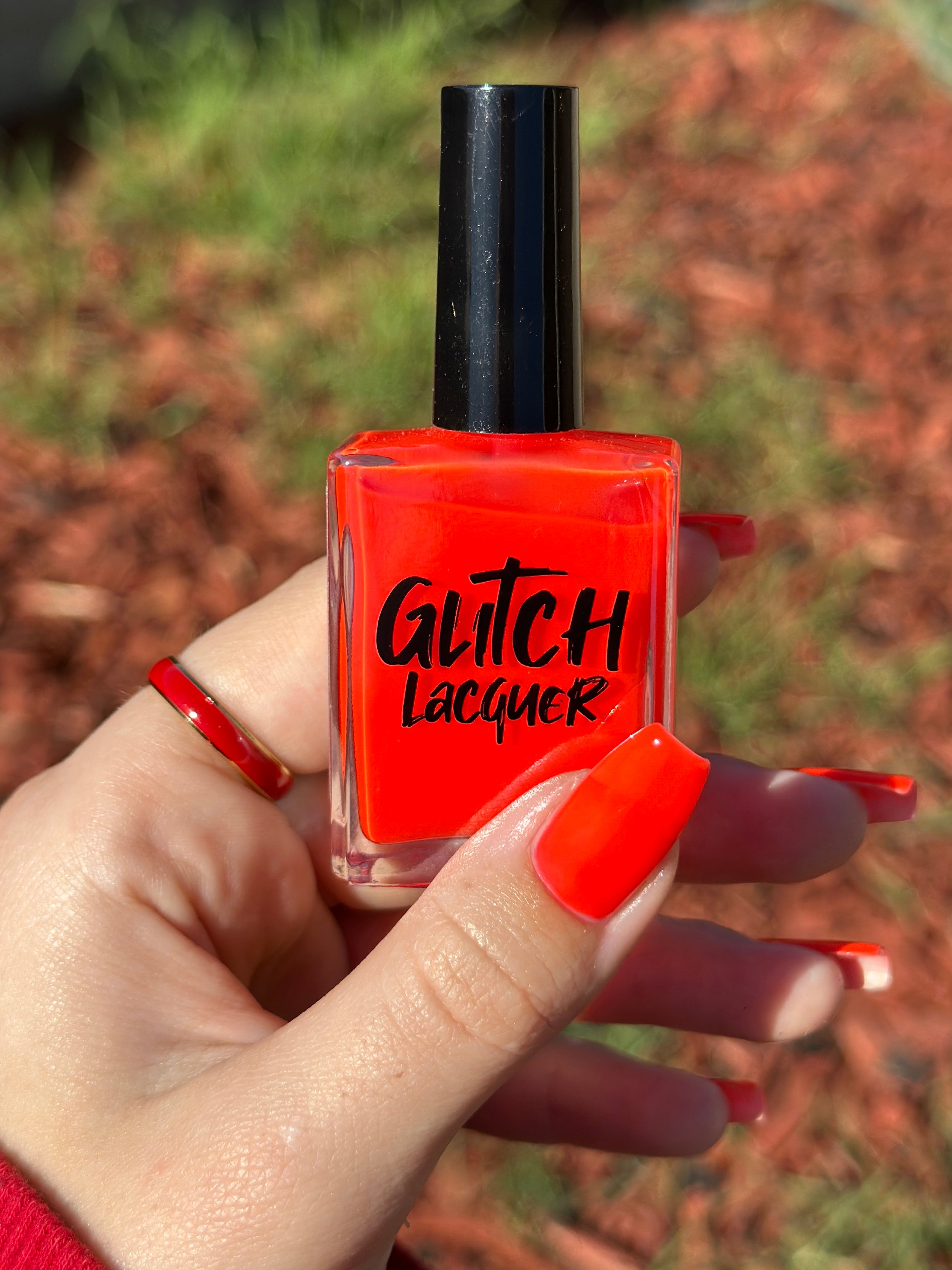 Palestinian Poppy by Glitch Lacquer, warm red crelly bottle and swatch on light skin tone