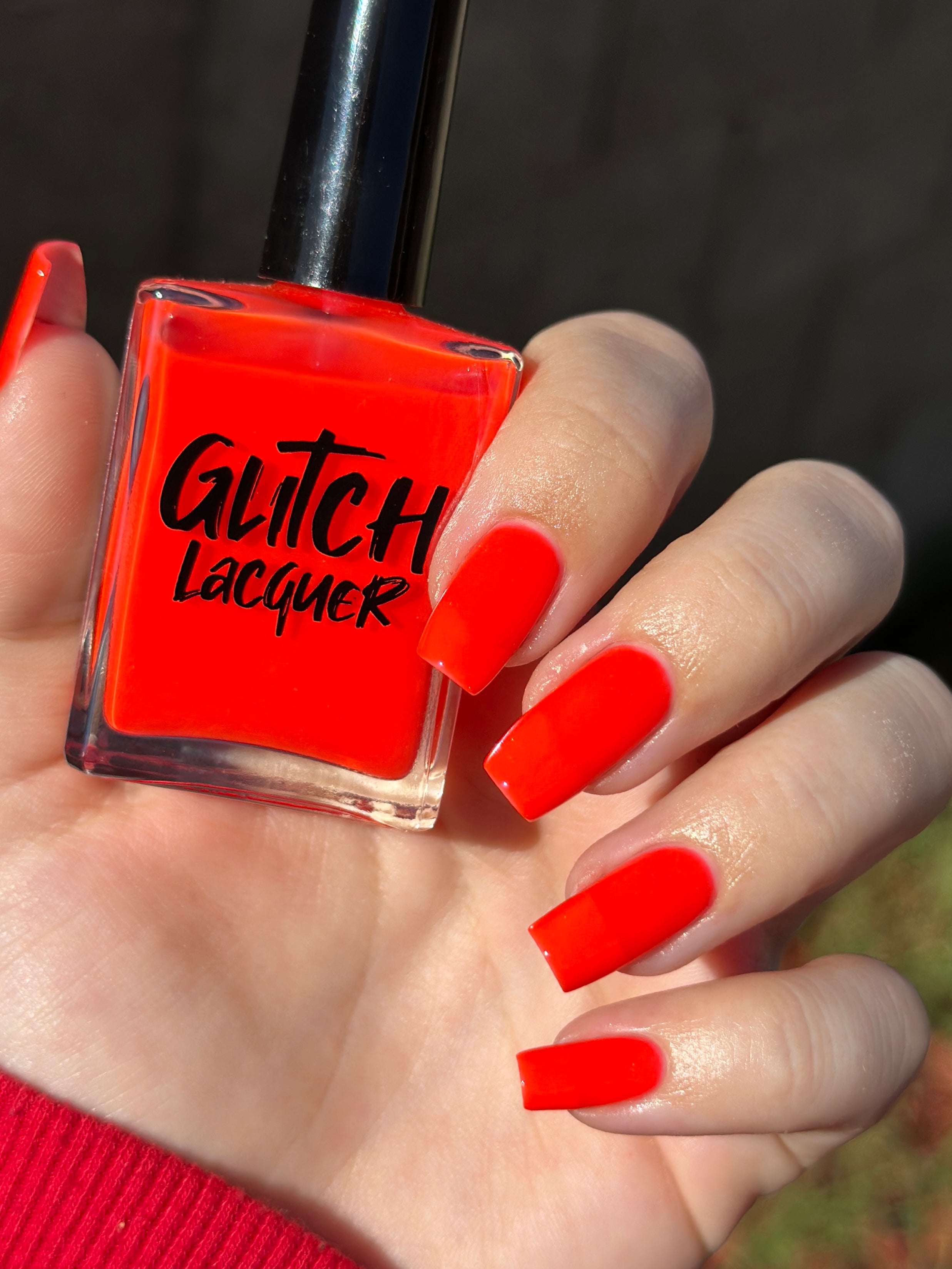 Palestinian Poppy by Glitch Lacquer, warm red crelly bottle and swatch on light-medium skin tone