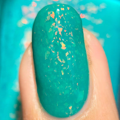 Kuang Si Falls by Chamaeleon Nails, macro close-up of orange-to-yellow iridescent multichrome flakies over neon teal base