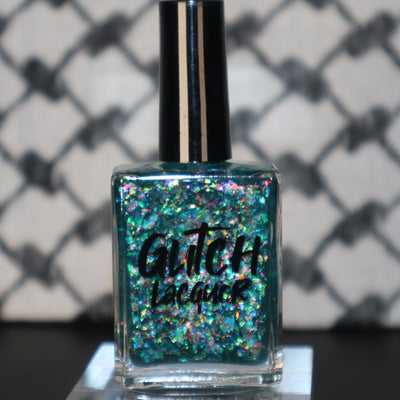 Medo by Glitch Lacquer, teal jelly with iridescent flakies bottle standalone product shot