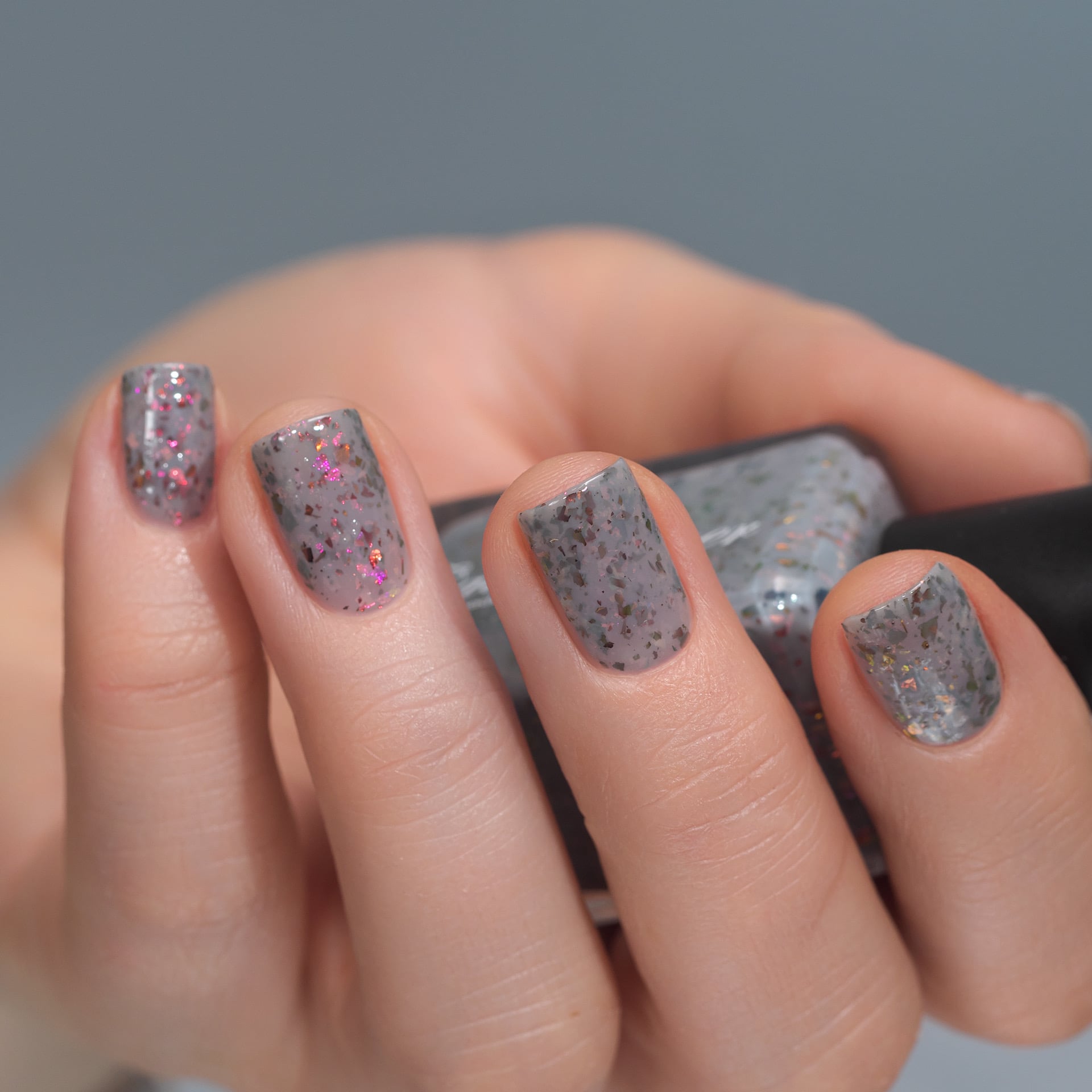 Cadillacquer Daydreaming grey red chameleon iridescent crelly nail polish, swatched on eight nails, light skin, studio lighting