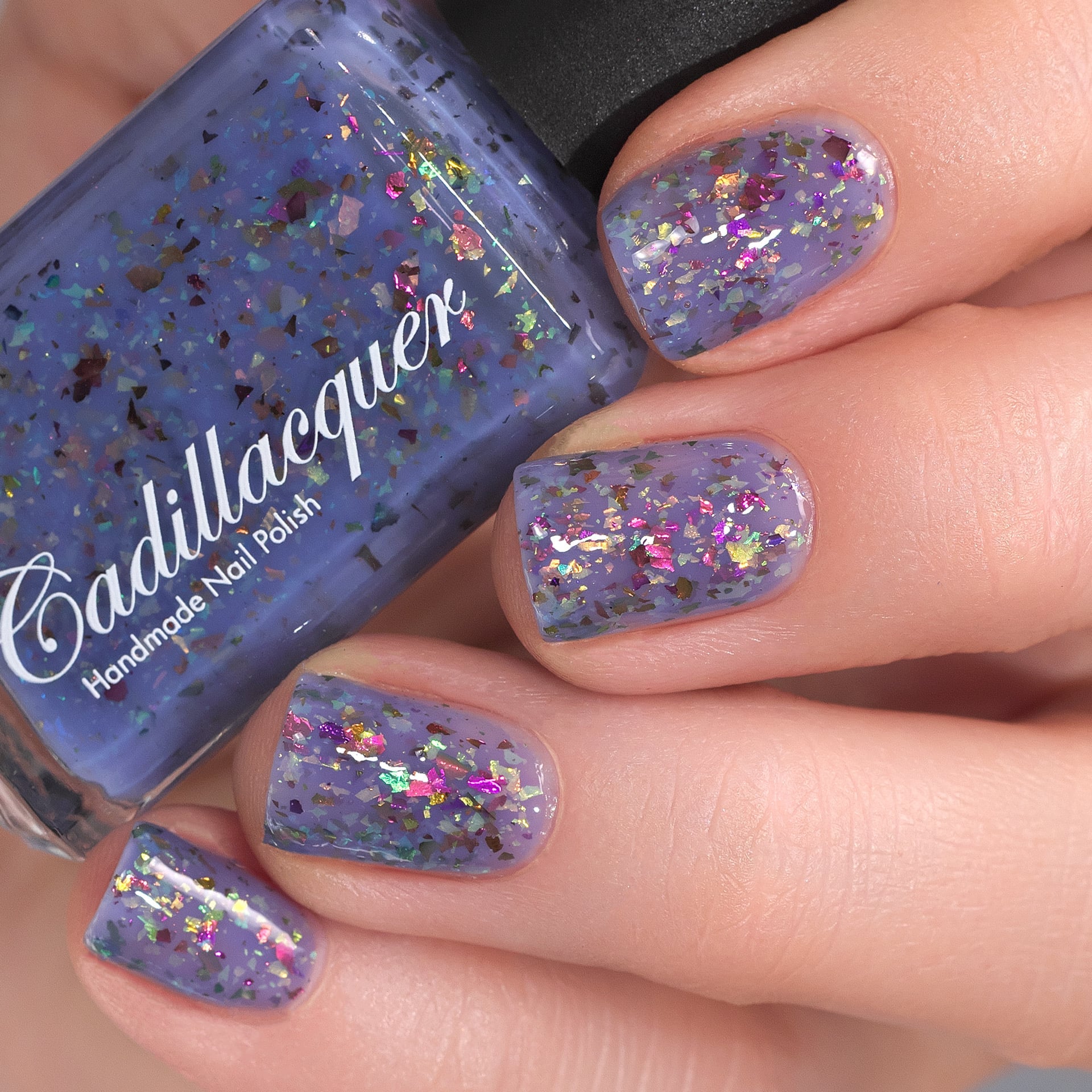Cadillacquer Don't Worry purple pink chameleon iridescent crelly nail polish, swatched on eight nails, light skin, bright daylight lighting