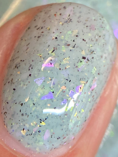 Cadillacquer Fresh Sheets pastel mint iridescent crelly nail polish, macro single-nail swatch, light-medium skin, bright daylight lighting