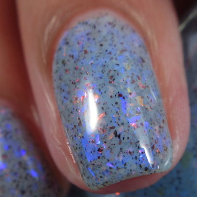 Cadillacquer Just Breathe pastel blue iridescent crelly nail polish, macro single-nail swatch, light skin, bright daylight lighting