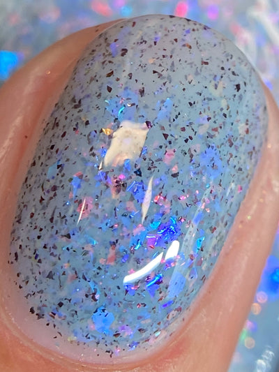 Cadillacquer Just Breathe pastel blue iridescent crelly nail polish, swatched on one nails, light skin, direct flash lighting