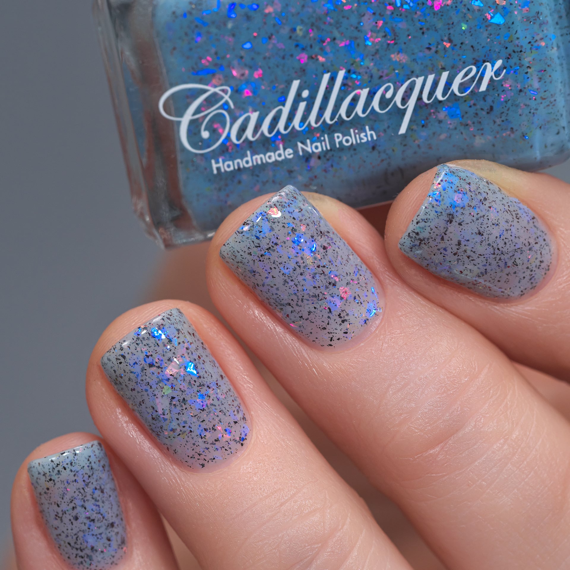 Cadillacquer Just Breathe pastel blue iridescent crelly nail polish, swatched on four nails, light skin, studio lighting, by @Lakodzen