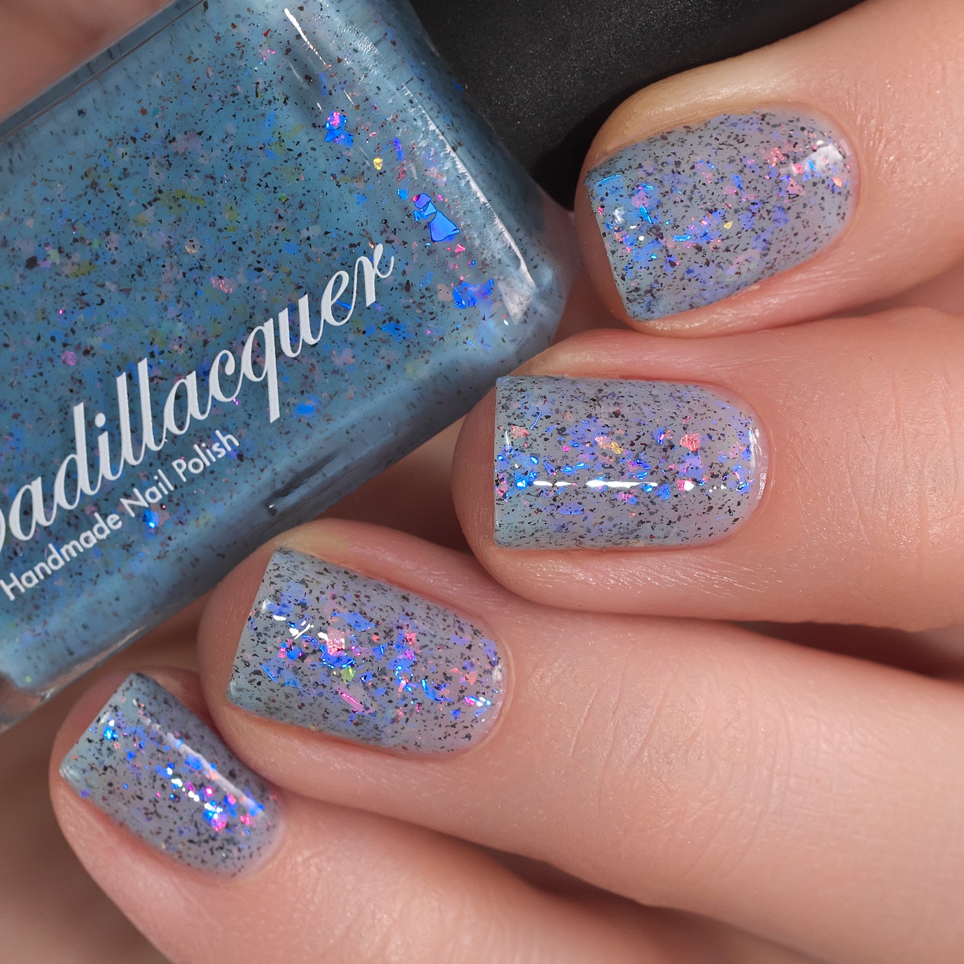 Cadillacquer Just Breathe pastel blue iridescent crelly nail polish, swatched on four nails, light skin, studio lighting, by @Lakodzen