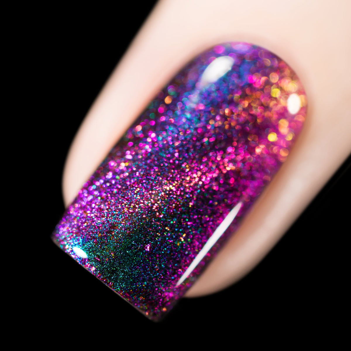 Close-up of Cadillacquer Like A Storm nail polish showing multichrome shift and magnetic flakies, swatched by @rafinails