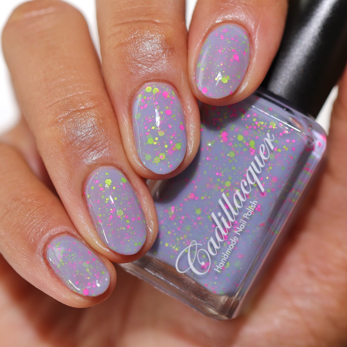 Cadillacquer Magical Creatures pastel lilac crelly nail polish held with bottle