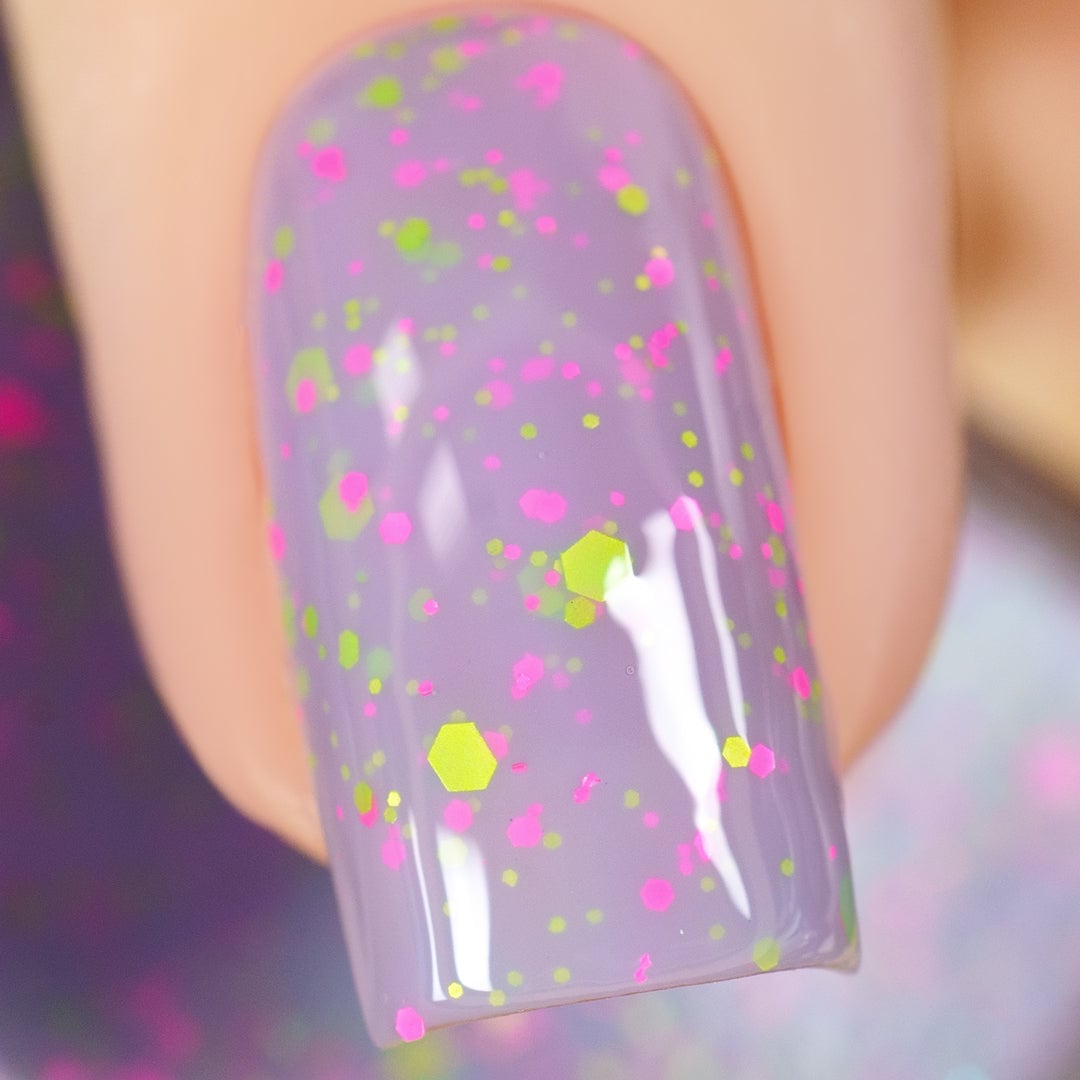 Cadillacquer Magical Creatures nail polish swatch, pastel lilac with neon glitter
