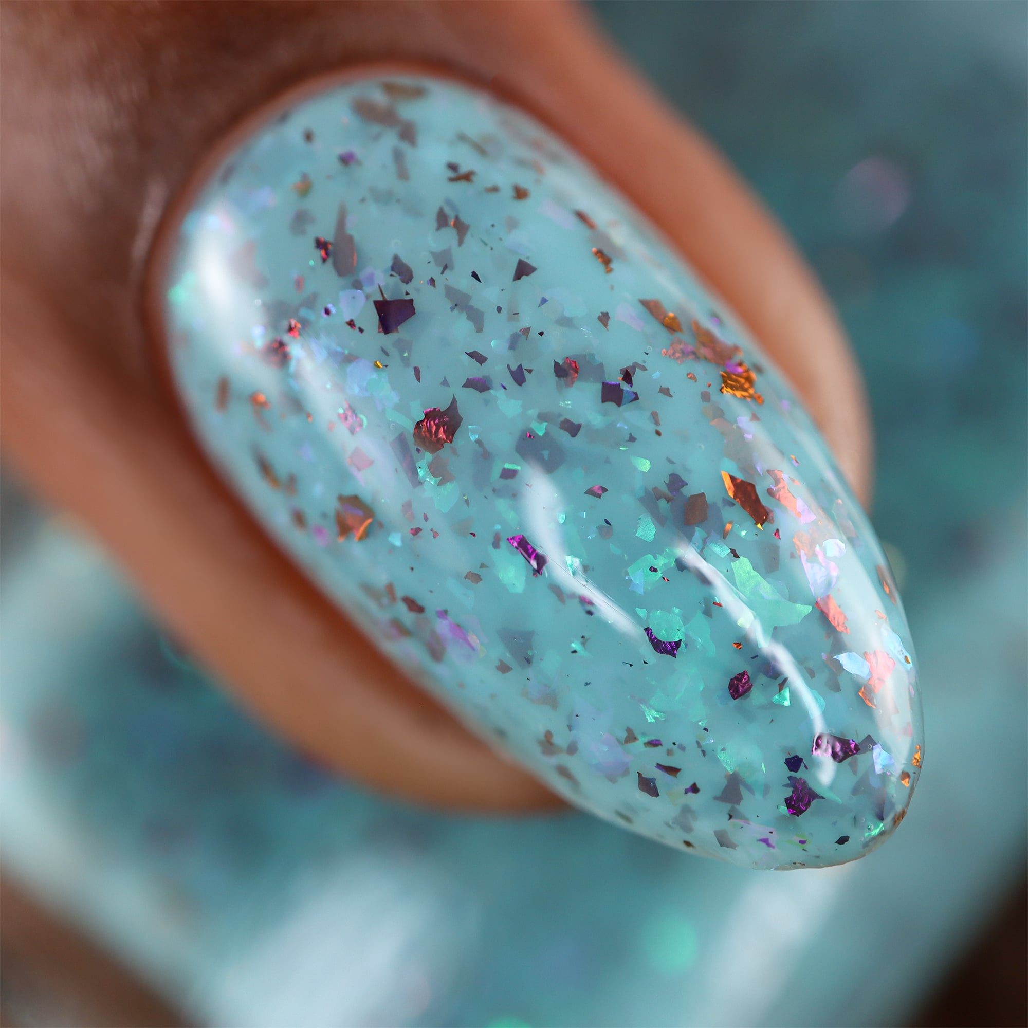 Cadillacquer Pastel Thoughts pastel teal purple chameleon iridescent crelly nail polish, macro single-nail swatch, light-medium skin, studio lighting