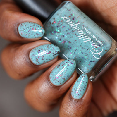 Cadillacquer Pastel Thoughts pastel teal purple chameleon iridescent crelly nail polish, swatched on eight nails, deep skin, studio lighting