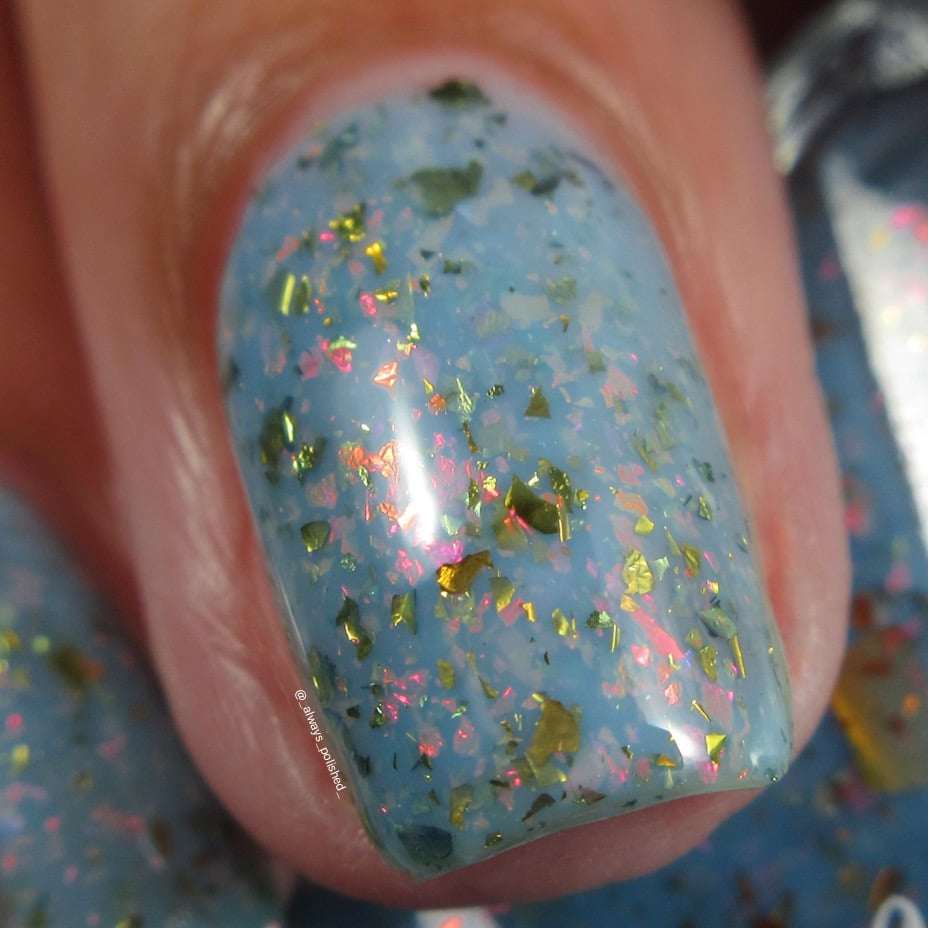 Cadillacquer Slow Mornings light blue gold chameleon iridescent crelly nail polish, macro single-nail swatch, light skin, indoor warm lighting