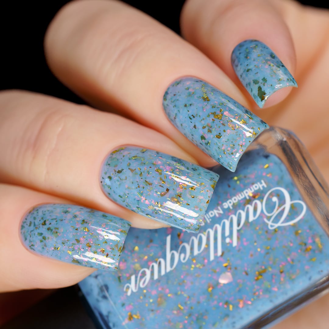 Cadillacquer Slow Mornings light blue gold chameleon iridescent crelly nail polish, swatched on four nails, light skin, studio lighting