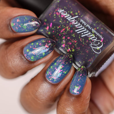 Thermal glitter-and-flake Cadillacquer nail polish in Strange Happenings, shown swatched on five almond-shaped nails held alongside the bottle, nails display the warm dusty slate blue state densely packed with large hot pink iridescent flakes and neon lime green matte glitter hexes and micro dots, while the bottle shows the dark blackened eggplant cold state, deep skin tone, studio lighting, swatched by @doseoflolade