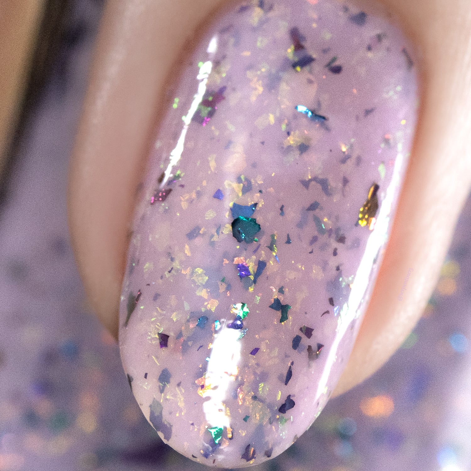 Cadillacquer Sweet Nothing pink teal chameleon iridescent crelly nail polish, macro single-nail swatch, light skin, studio lighting