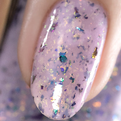 Cadillacquer Sweet Nothing pink teal chameleon iridescent crelly nail polish, macro single-nail swatch, light skin, studio lighting