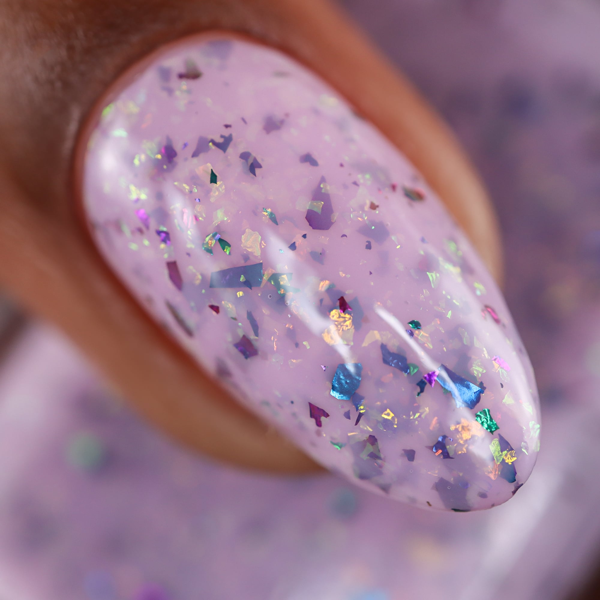 Cadillacquer Sweet Nothing pink teal chameleon iridescent crelly nail polish, macro single-nail swatch, light-medium skin, studio lighting