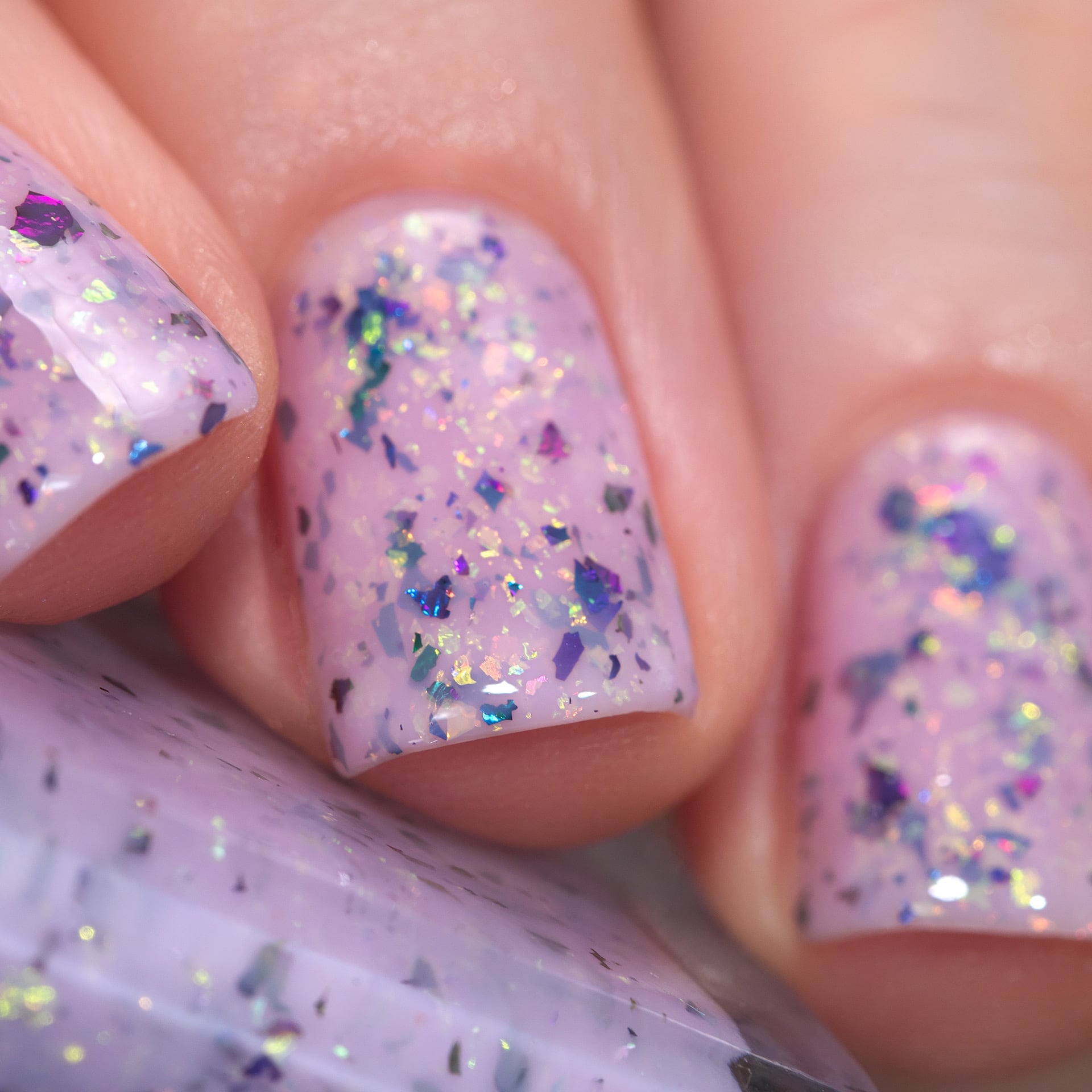 Cadillacquer Sweet Nothing pink teal chameleon iridescent crelly nail polish, swatched on three nails, light skin, studio lighting