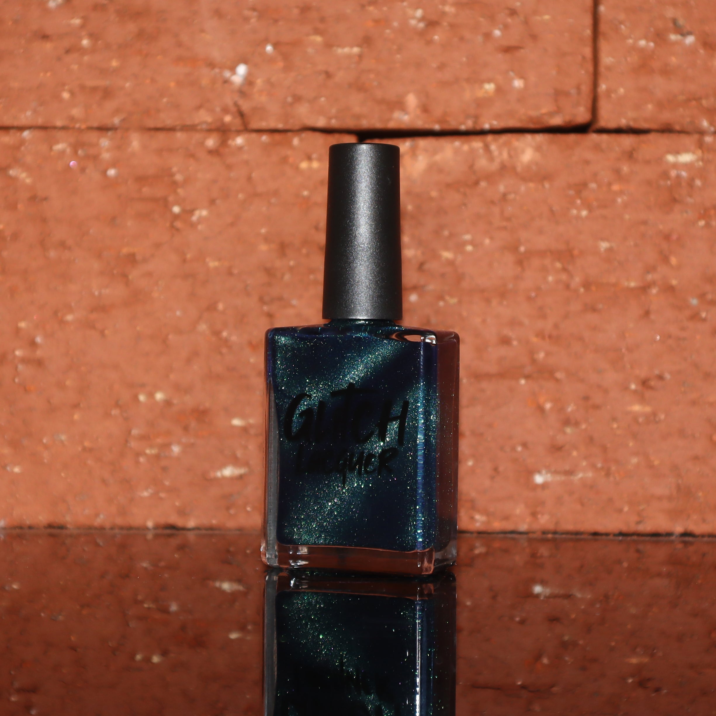 Do-Nuts by Glitch Lacquer, deep blue jelly with green-to-teal-to-blue magnetic, bottle