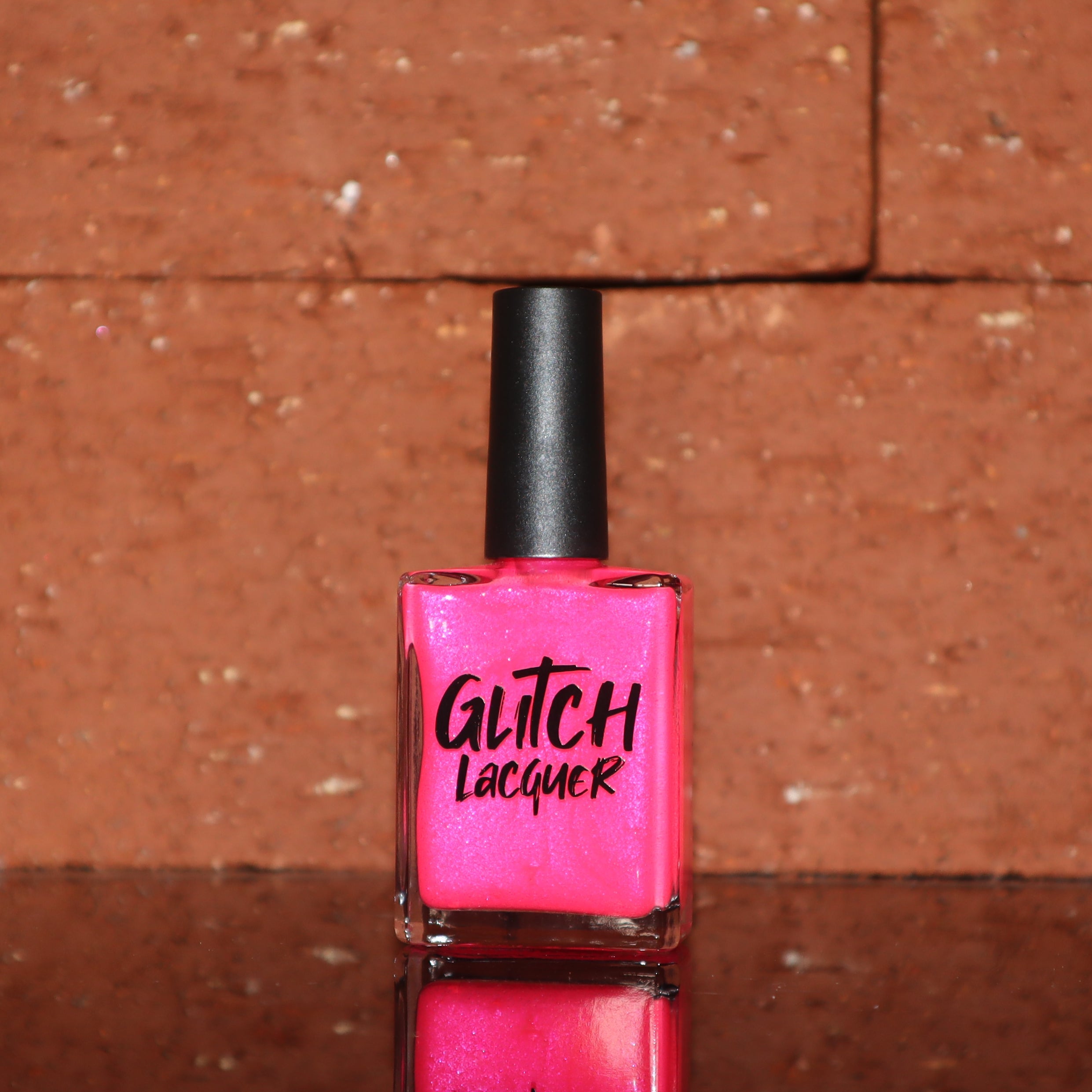 ACT UP by Glitch Lacquer, neon pink crelly with cool-toned pink sparkle, bottle