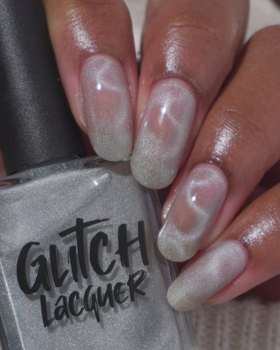 Ally by Glitch Lacquer, silver holographic magnetic topper, magnetic wave, on medium skin tone squoval nails