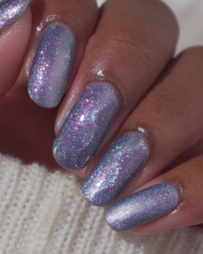Protect the Dolls by Glitch Lacquer, blue jelly, color-shift shimmer, holo sparkle, on medium skin tone square nails
