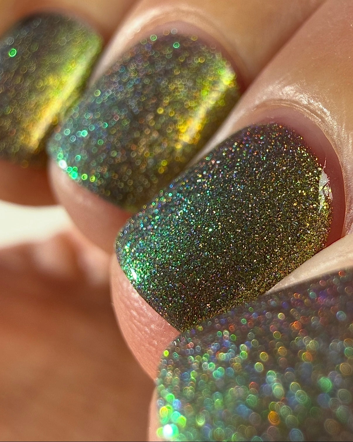 Safe House Glow by Glitch Lacquer, grey, gold-to-teal multichrome shift, holo shimmer, light-medium skin tone square nails
